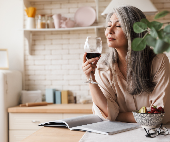 Woman drinking a glass of red wine