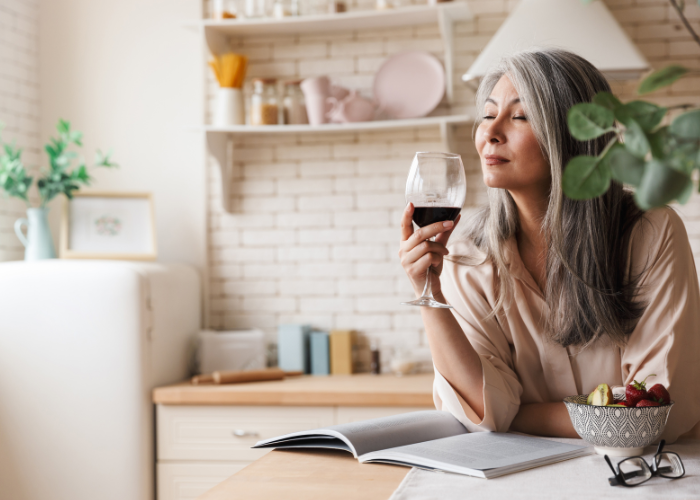Woman drinking a glass of red wine